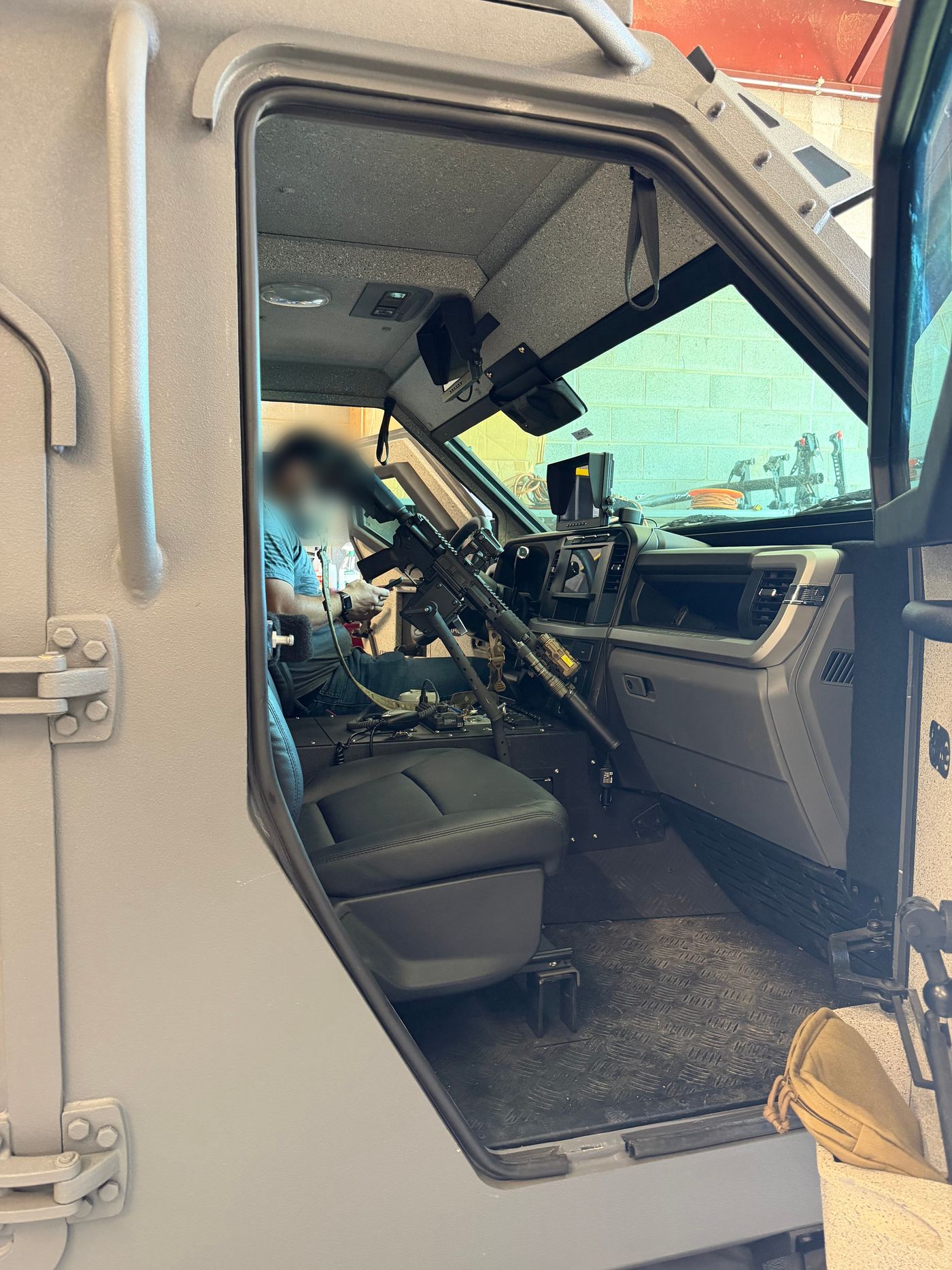StandA.R.D. rifle mount installed in an IAG Sentinel armored vehicle, seen through the open armored door
