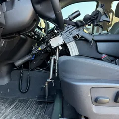 StandA.R.D. vehicle rifle mount holding a patrol AR-15 beside the driver seat