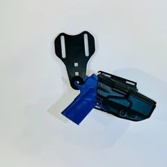 Duty holster with training pistol mounted on the Drop R.O.E.t8, angled view