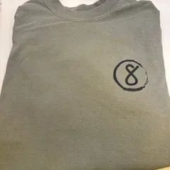 Folded Pl8tek tee with circle-8 chest logo