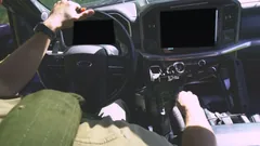 Driver's view of a rifle secured on the StandA.R.D. in a Ford F-150